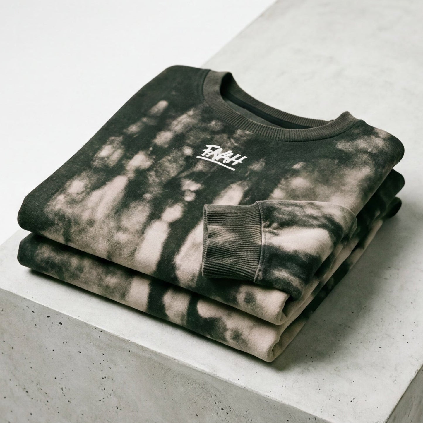FAMH organic cotton sweatshirt displayed on a hanger, folded, and hanging against a white background.
